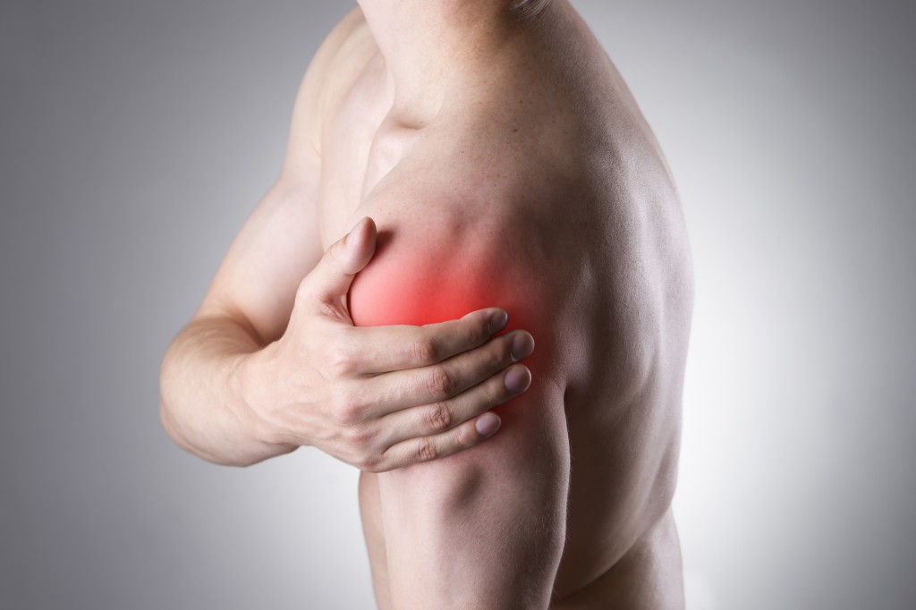 Man with pain in shoulder. Pain in the human body